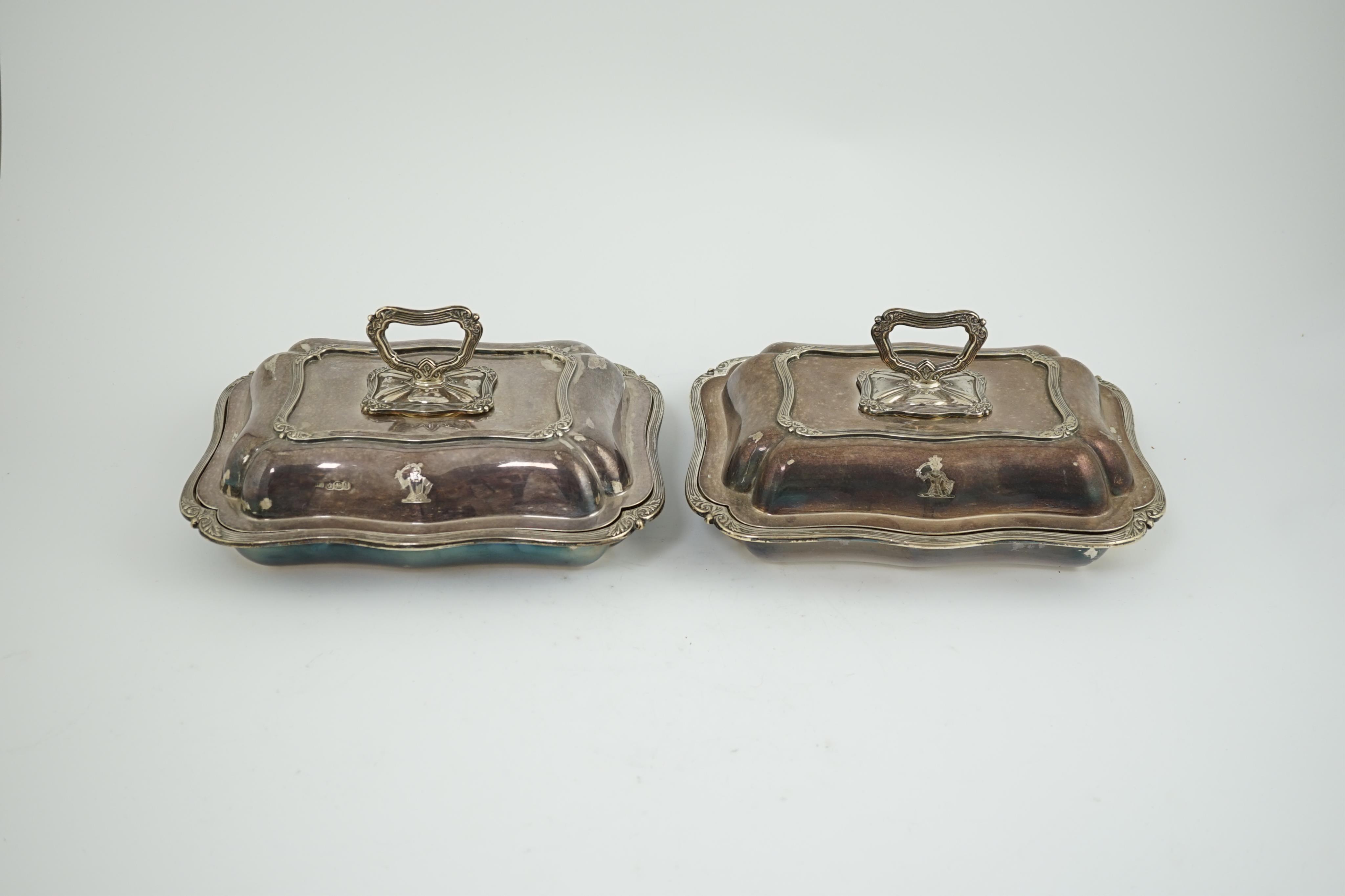 A pair of late Victorian silver entreé dishes and covers, with handles, by Harrison Brothers